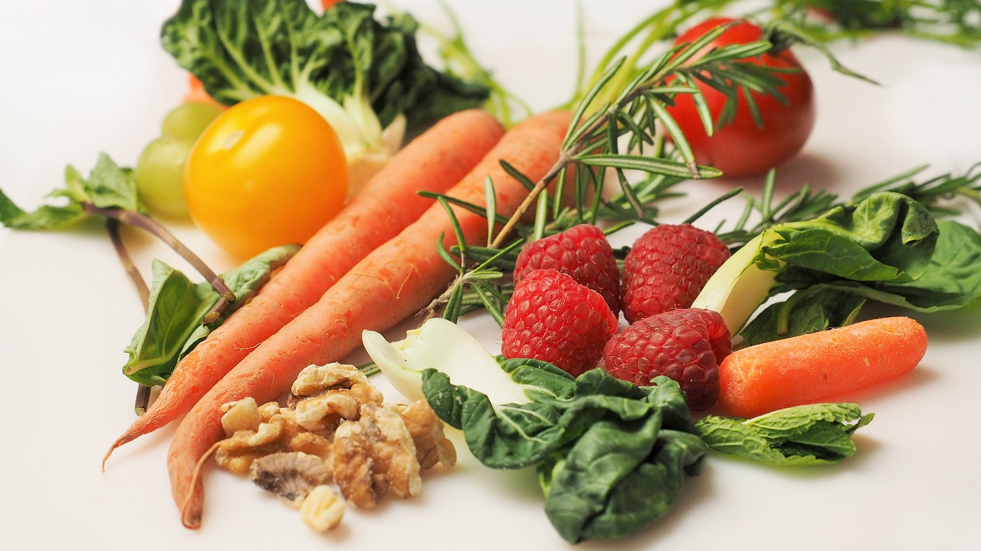 A collection of fresh fruits, vegetables, and nuts lie on a table. Eat for Life is here to help you identify the worst foods for guy health.